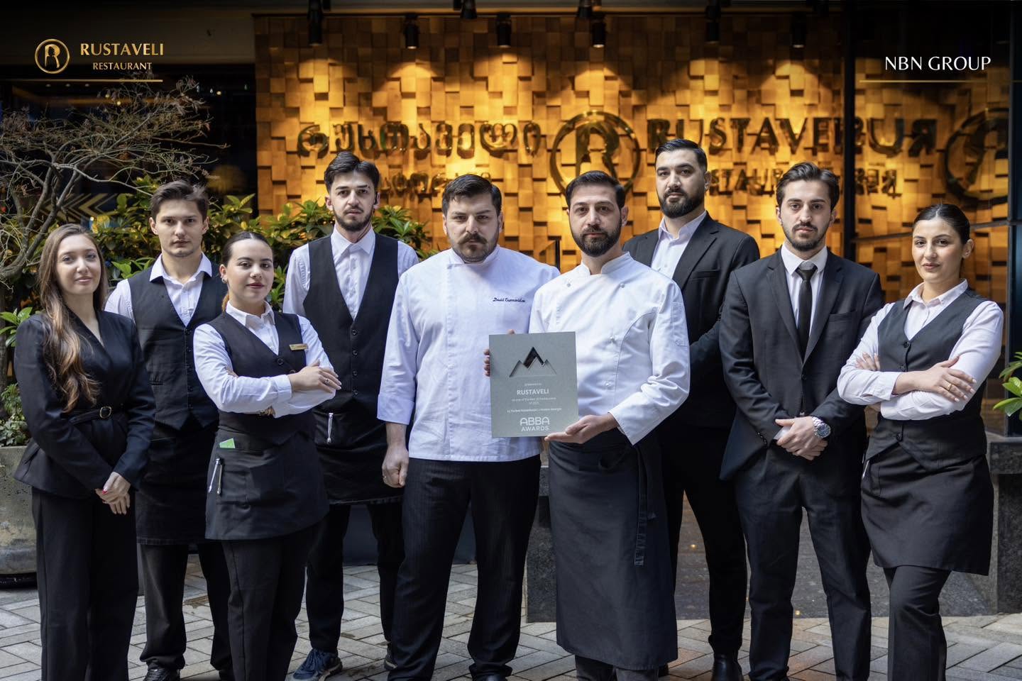 Rustaveli restaurant team holding the ABBA Awards recognition